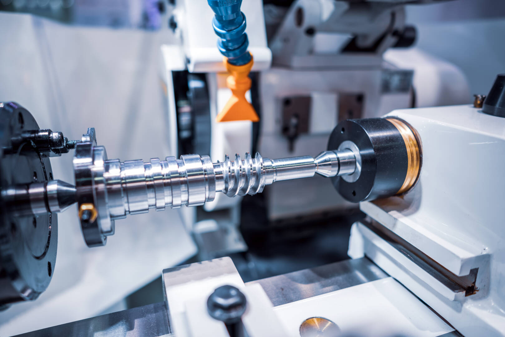 Metalworking CNC milling machine. Cutting metal modern processing technology. Small depth of field. Warning - authentic shooting in challenging conditions. A little bit grain and maybe blurred.